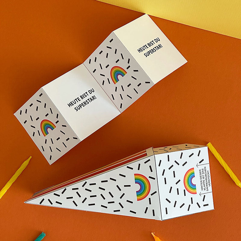Geschenkbox „Regenbogen“ zum Selbermachen – Bastelvorlage zum Ausdrucken, Ausschneiden und Befüllen inklusive Klappkarte